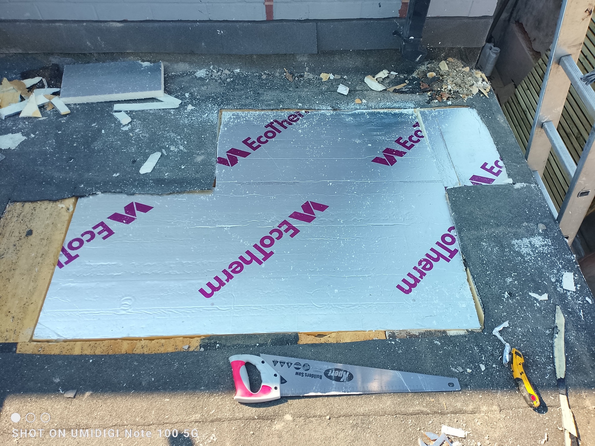 EcoTherm PIR insulation boards being fitted on a flat roof rebuild