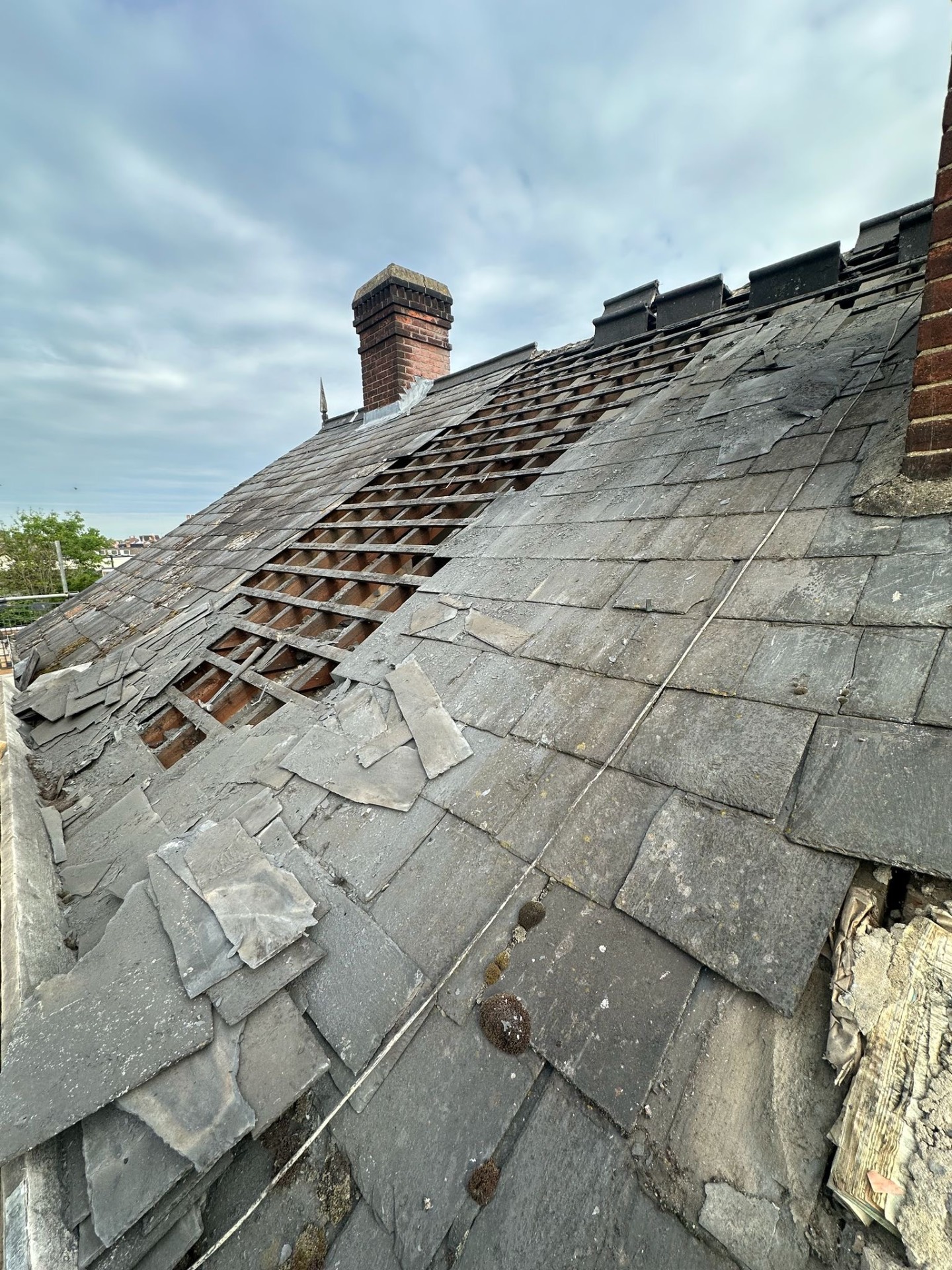Severely damaged Victorian slate roof needing full renewal