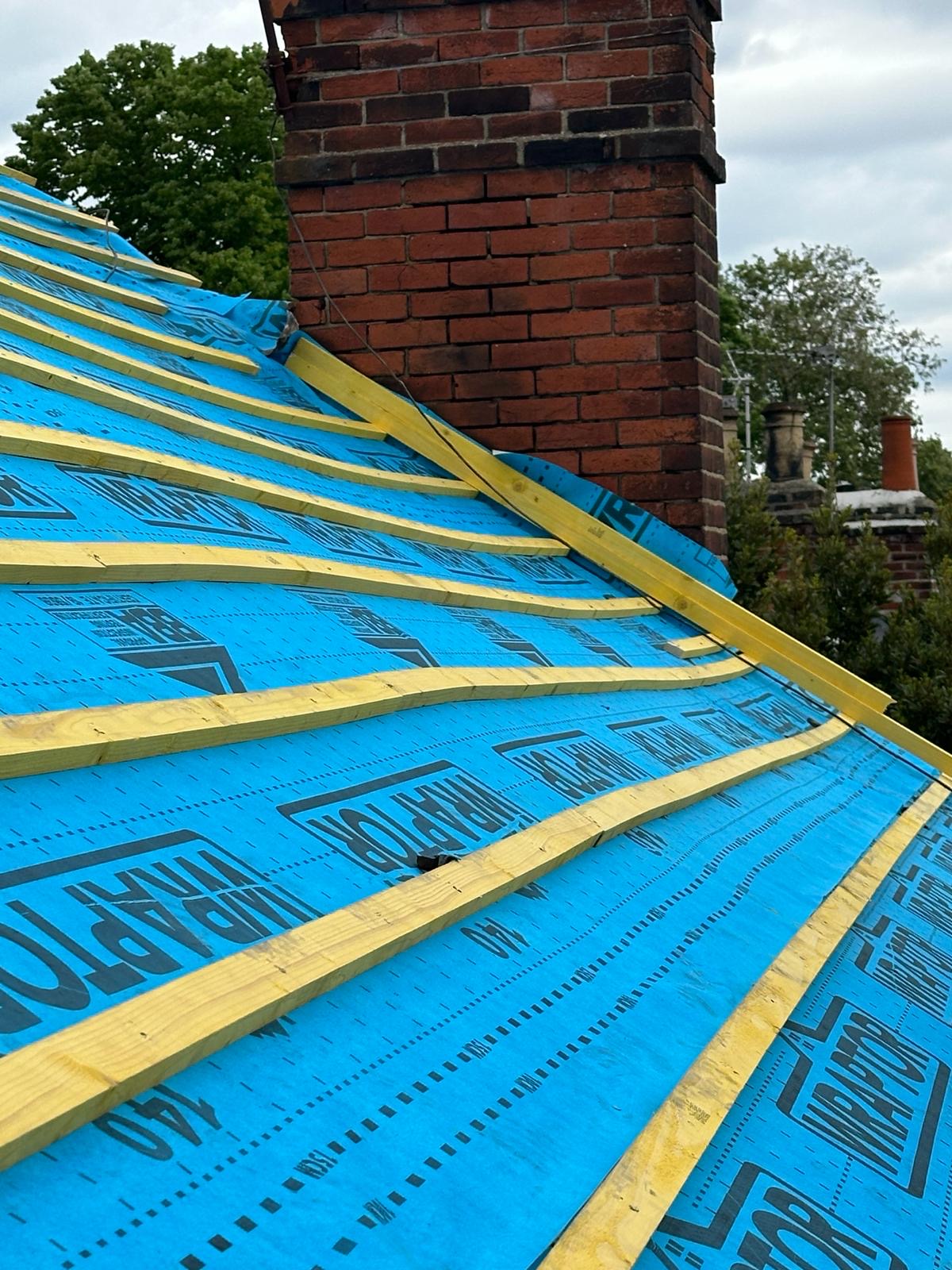 Wraptor membrane and battens dressed neatly around chimney stack