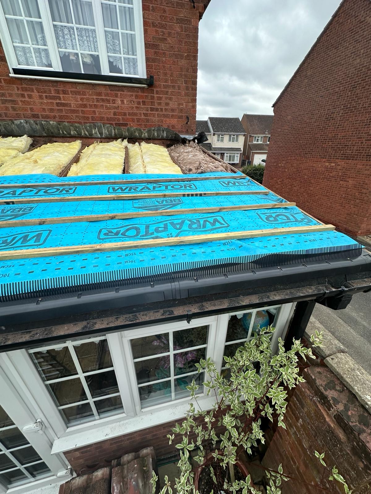 Wraptor membrane and battens over fresh mineral wool insulation on a bay