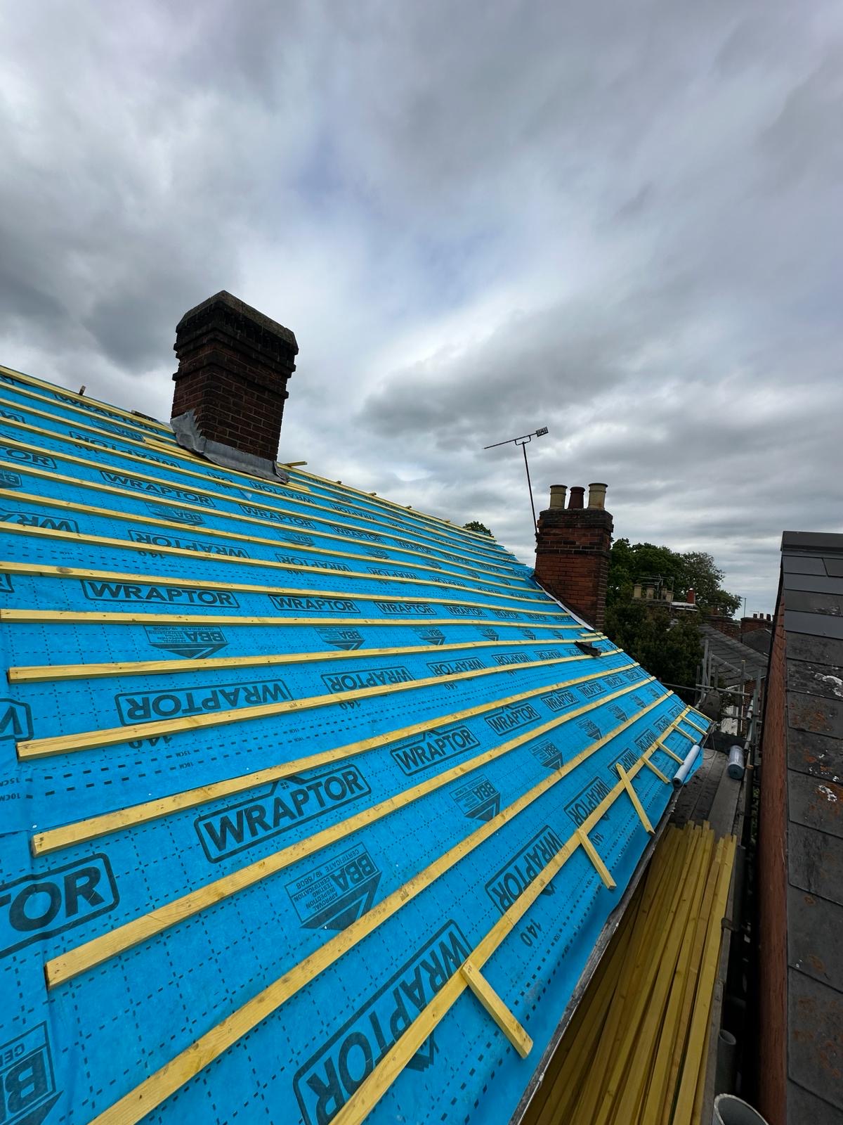 Full pitch of Wraptor membrane and yellow battens ready for tiles