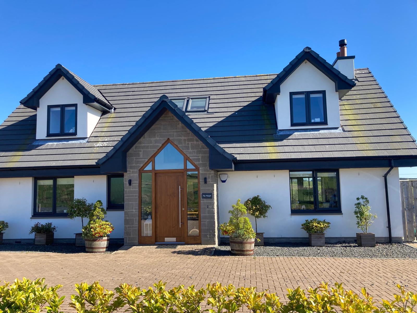 Premium slate roof on a Suffolk home at sunset